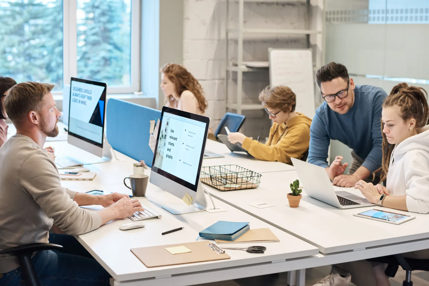 Business team working with computers in a modern office