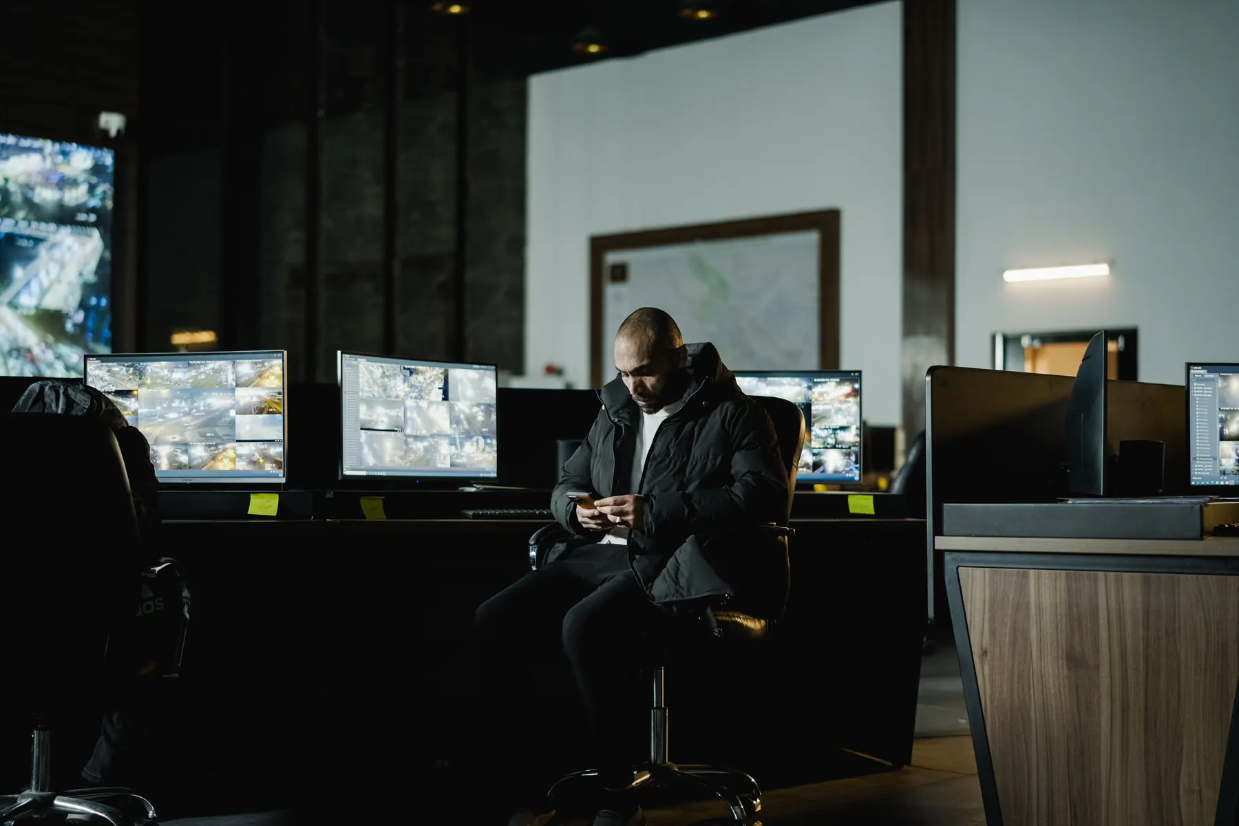 Security operations professional working in a monitoring center
