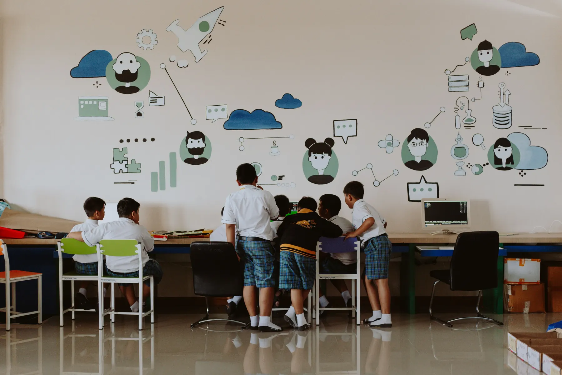 Students using technology in a school computer lab